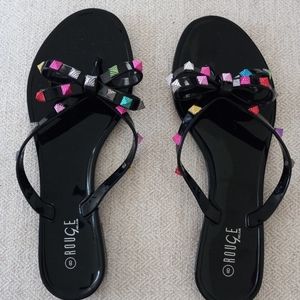 Slip on Sandals. Shiny black with rainbow accents